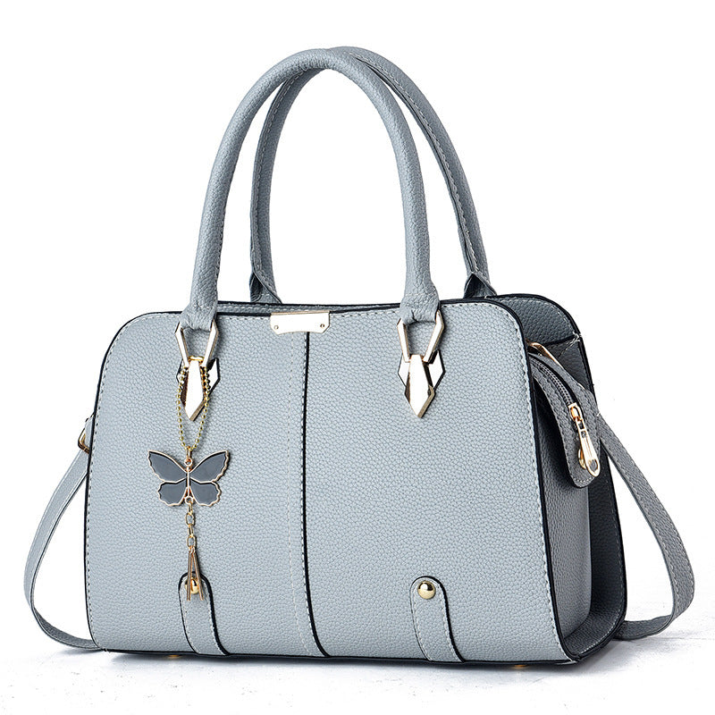 Women's Fashionable PU Leather Handbag With Butterfly Pendant